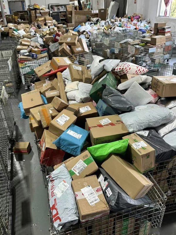 Daily outbound packages and parcels in shipment cages prepared for international delivery