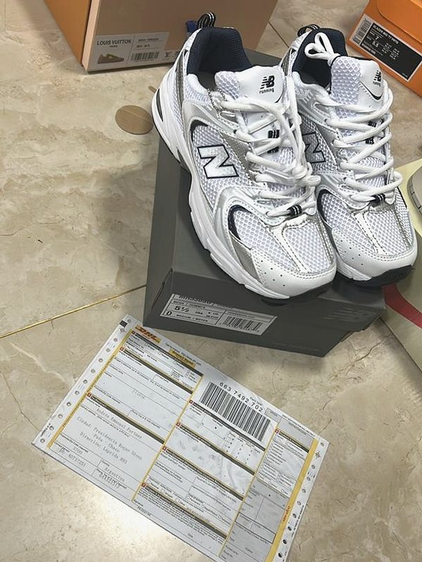 Verified order with DHL waybill — sneaker, box, and tracking documentation